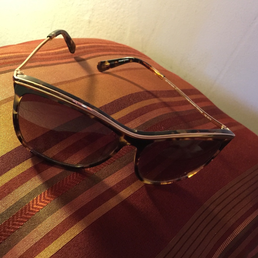 Sunglasses, Handbags with Matching Tunic Tops, Scarfs, and Paintings.